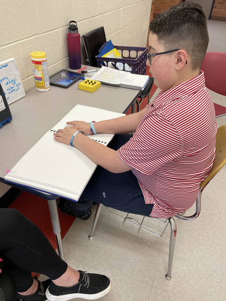 Student Reading Braille